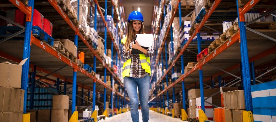 portrait-confident-female-worker-walking-through-distribution-warehouse_342744-1458